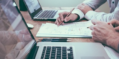Professionals collaborating on technical documentation